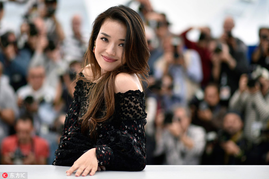 Chinese actress Gong Li waves during the opening ceremony for the