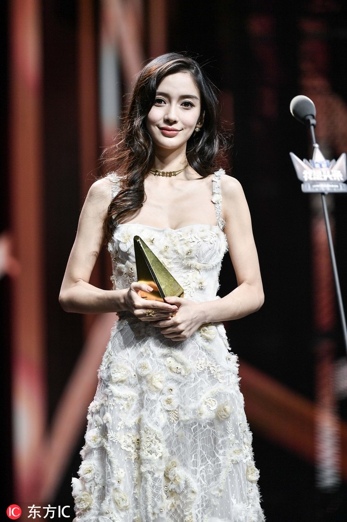 Chinese actress Zhou Dongyu poses as she arrives on the red carpet